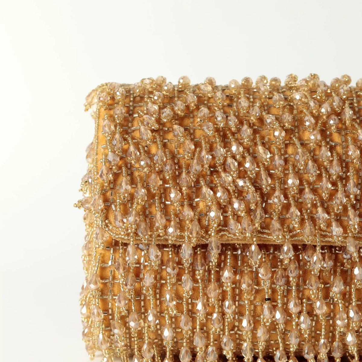Rosa beaded flap-over clutch bag by The Tan Clan, featuring intricate beadwork and a stylish design for evening occasions.