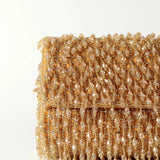 Rosa beaded flap-over clutch bag by The Tan Clan, featuring intricate beadwork and a stylish design for evening occasions.