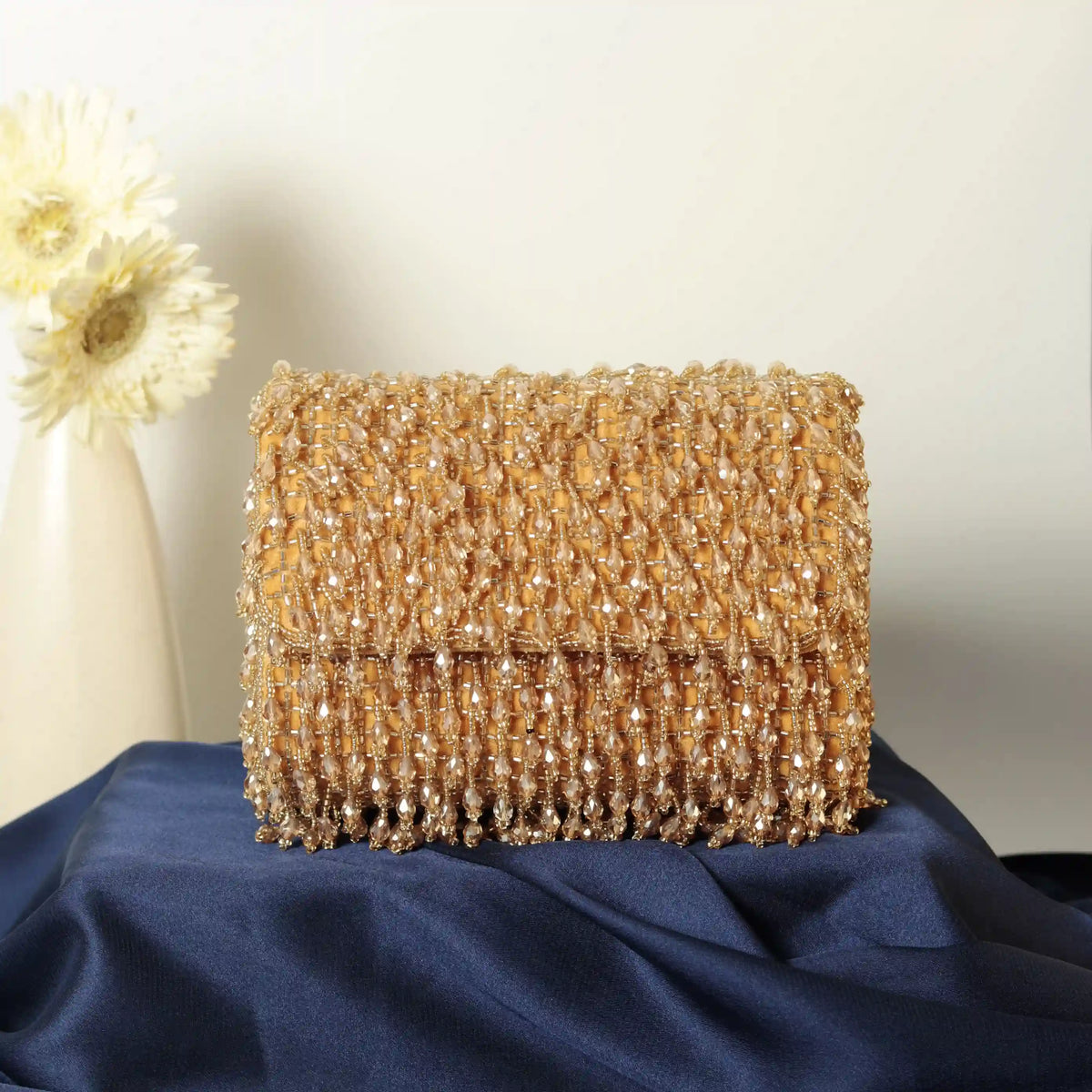 Rosa beaded flap-over clutch bag by The Tan Clan featuring intricate beadwork and a stylish design for elegant occasions.
