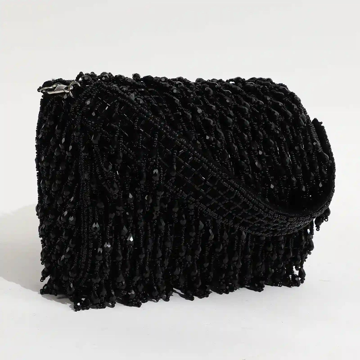 Rosa beaded flap-over clutch bag by The Tan Clan with intricate beadwork and elegant design, perfect for evening occasions.