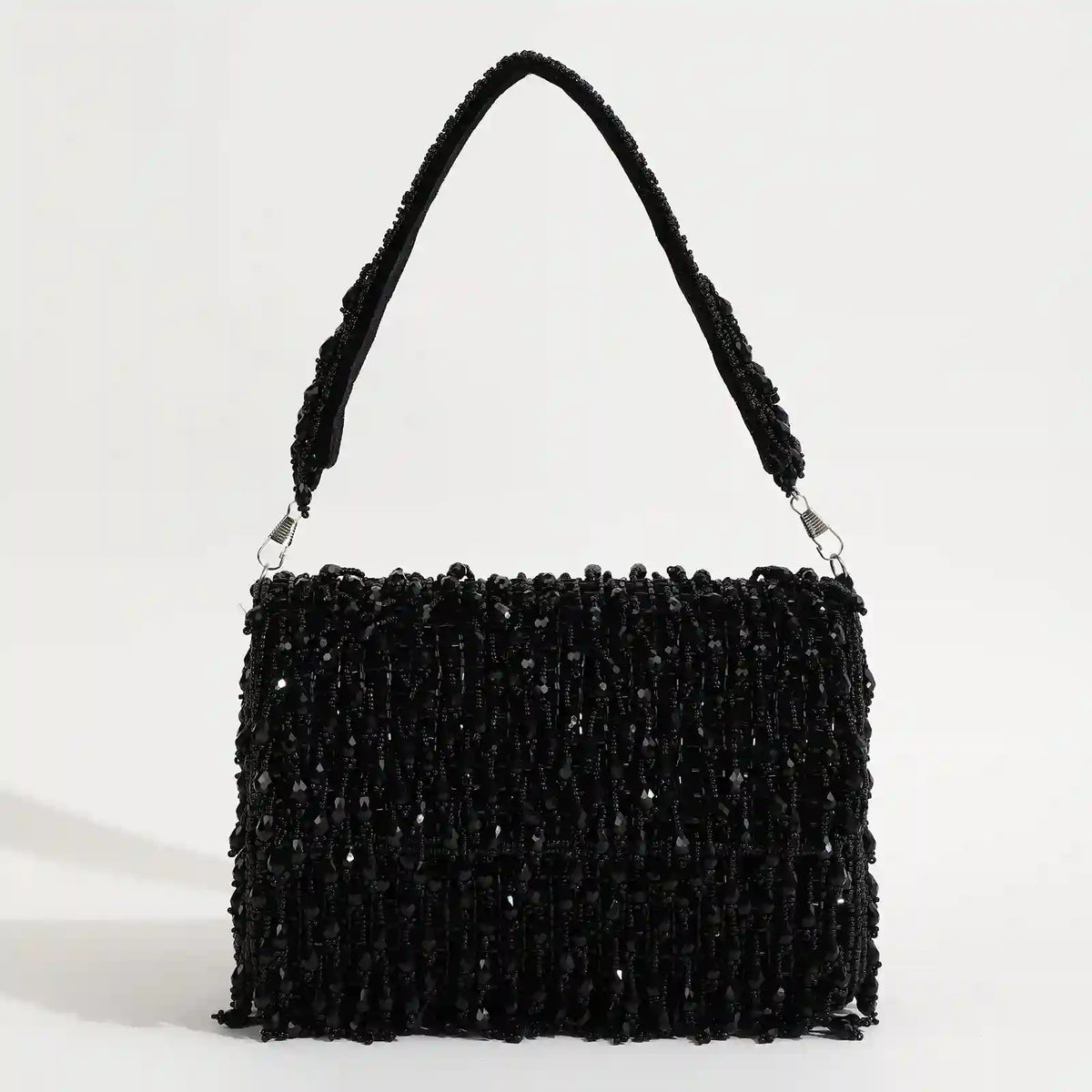 Rosa beaded flap-over clutch bag by The Tan Clan featuring intricate beadwork and elegant design for evening occasions.