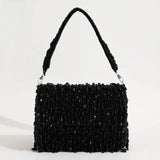 Rosa beaded flap-over clutch bag by The Tan Clan featuring intricate beadwork and elegant design for evening occasions.