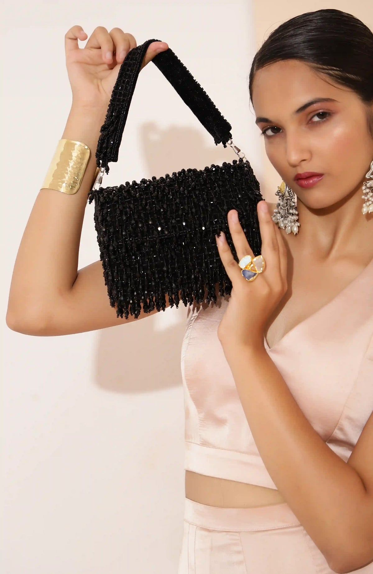 Rosa beaded flap-over clutch bag by The Tan Clan with intricate beadwork and elegant design for evening or special occasions.