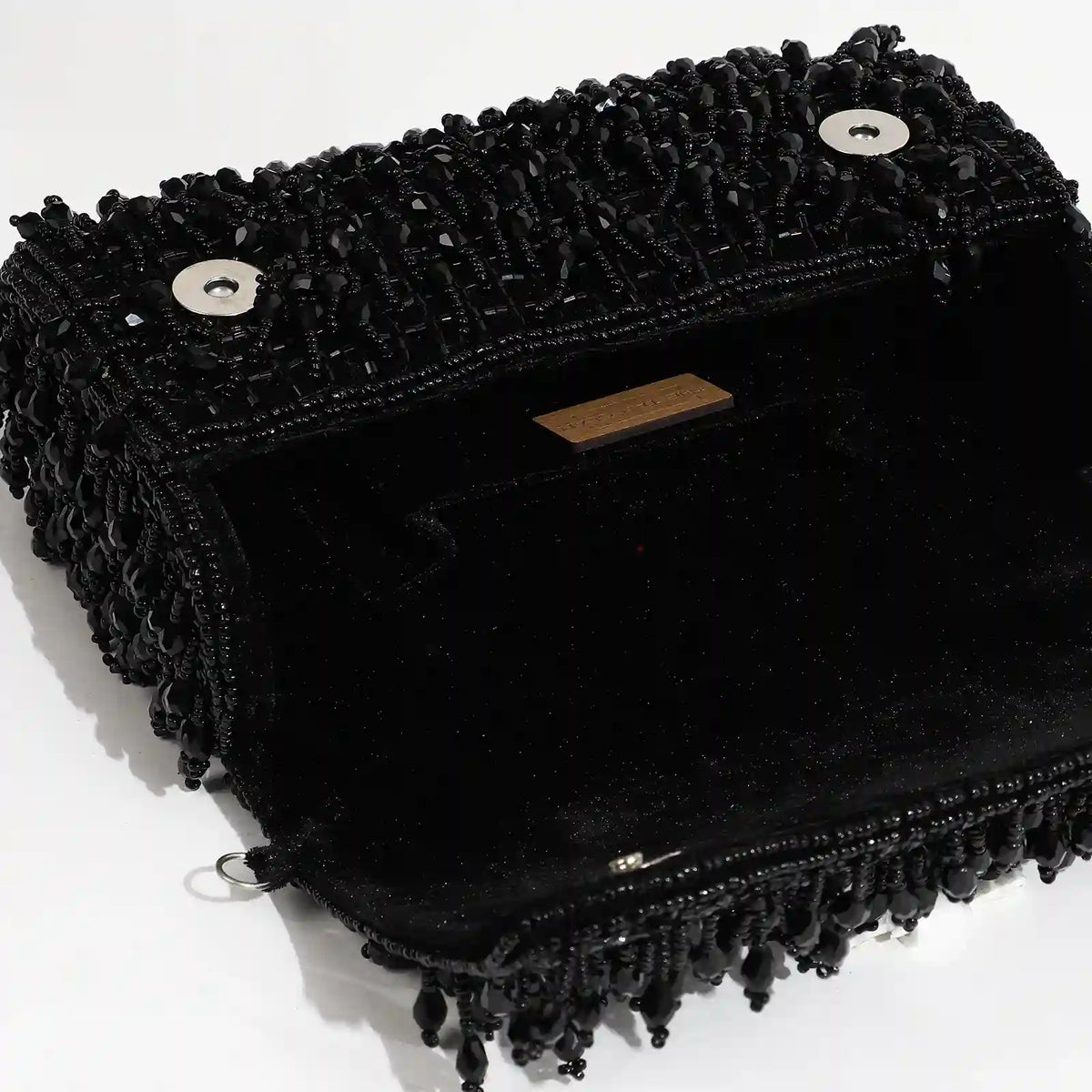 Rosa beaded flap-over clutch bag by The Tan Clan with intricate beaded details and a sleek, stylish design.