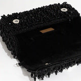 Rosa beaded flap-over clutch bag by The Tan Clan with intricate beaded details and a sleek, stylish design.