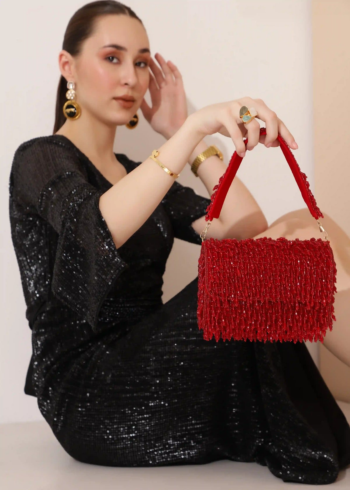 Rosa beaded flap-over clutch bag by The Tan Clan with intricate beadwork and elegant design for evening occasions.