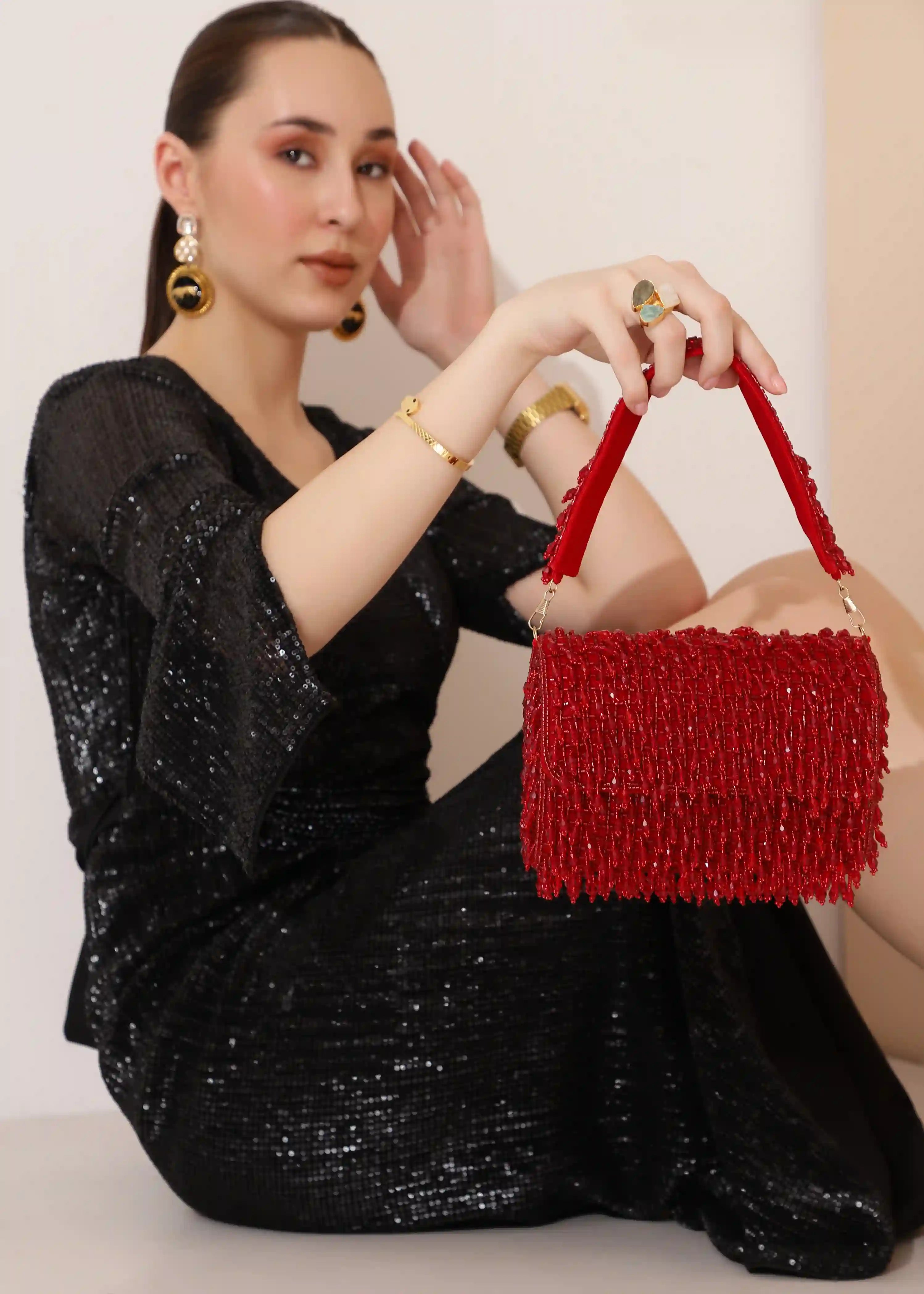Rosa beaded flap-over clutch bag by The Tan Clan featuring intricate beadwork and a compact, elegant design.