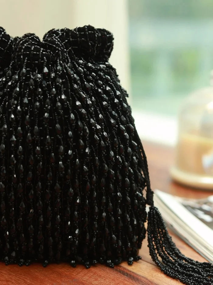 Rosa black Potli bag with handle from The Tan Clan, featuring a traditional drawstring closure and elegant design.