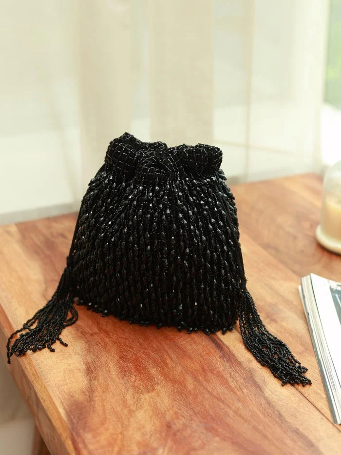 Rosa black Potli bag with handle by The Tan Clan, featuring traditional Indian design and decorative embellishments.
