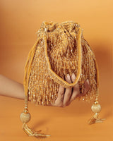 Rosa Potli bag with handle from The Tan Clan, featuring traditional design and vibrant pink color, ideal for elegant occasions.