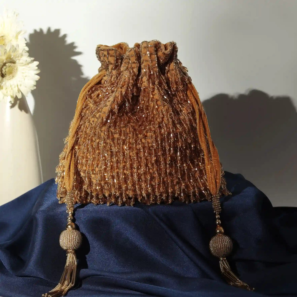 Rosa Potli Bag with Handle by The Tan Clan, cream-colored traditional Indian handbag with embroidered floral design