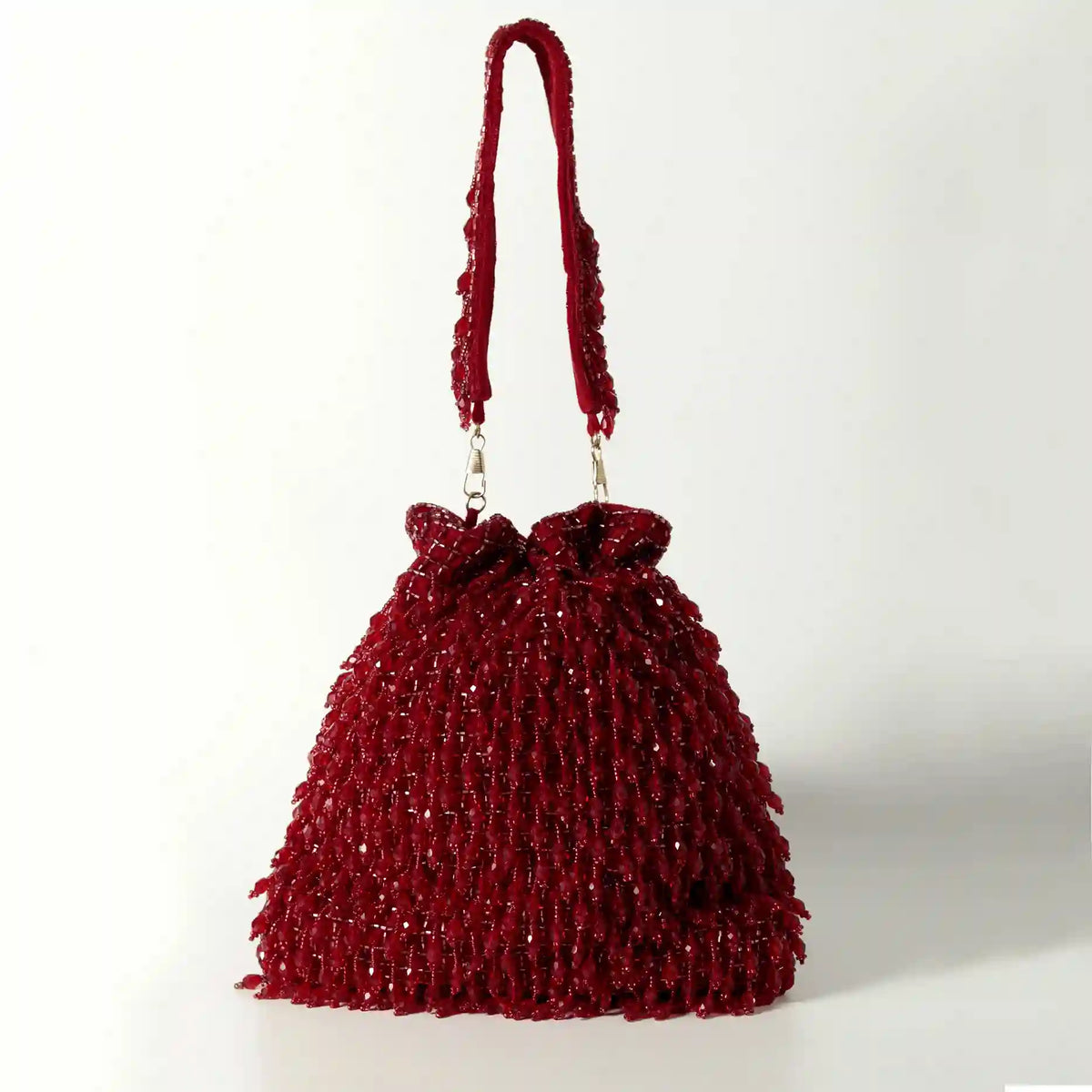 Red Rosa Potli bag with handle by The Tan Clan, featuring traditional design and vibrant color for stylish occasion use.