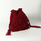 Red Rosa Potli bag with handle by The Tan Clan, featuring intricate design and traditional Indian craftsmanship.