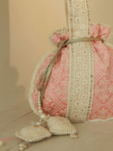 Pink Ruhi Potli Bag with Handle from The Tan Clan, featuring traditional design and elegant drawstring closure.
