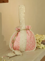 Pink Ruhi Potli Bag with handle by The Tan Clan, featuring traditional embroidery and compact design for elegant occasions.