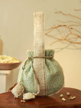 Ruhi Potli Bag with Handle by The Tan Clan, stylish traditional Indian clutch with decorative embroidery and a comfortable handle.