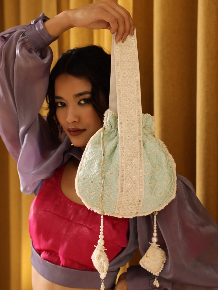 Ruhi Potli Bag with Handle by The Tan Clan, featuring traditional design and wooden handle for elegant hand-carry style.