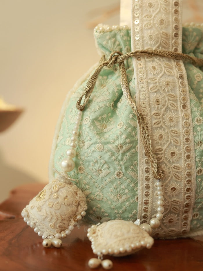 Ruhi Potli Bag with Handle by The Tan Clan featuring traditional design and fabric, suitable for festive or casual occasions.