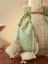 Ruhi Potli Bag with Handle by The Tan Clan featuring traditional design and fabric, suitable for festive or casual occasions.