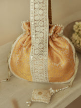 Yellow Ruhi Potli bag with handle from The Tan Clan, featuring intricate embroidery and traditional Indian design.
