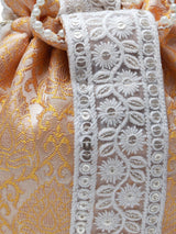 Yellow Ruhi Potli Bag with Handle by The Tan Clan, featuring traditional embroidery and a stylish drawstring closure.