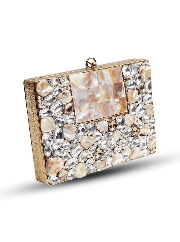 Brass clutch with intricate embellishments from The Tan Clan, featuring detailed design and elegant craftsmanship.