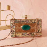 Golden embellished brass clutch bag with intricate design, perfect for elegant occasions, by The Tan Clan.