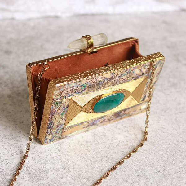 Golden embellished brass clutch bag with intricate design, featuring decorative details from the Sahiba collection by The Tan Clan.