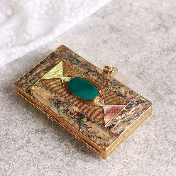 Golden embellished brass clutch bag with intricate details, stylish design, and a sleek shape from the Sahiba collection by The Tan Clan.