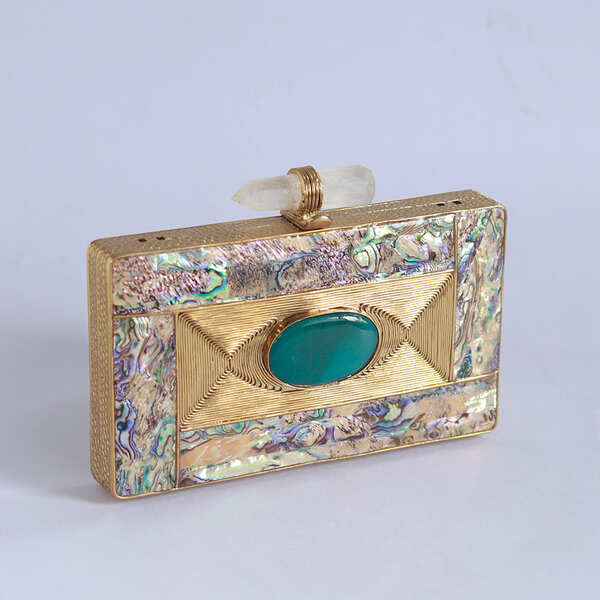 Golden embellished brass clutch bag with intricate details, designed by The Tan Clan for elegant occasions