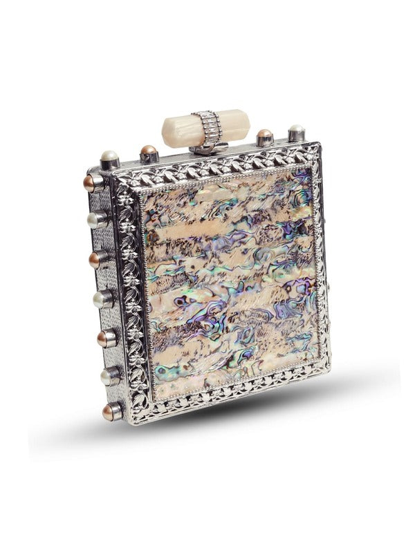 Salma Mother of Pearl Clutch by The Tan Clan featuring iridescent pearl design and elegant clasp for evening occasions.