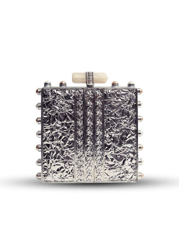 Salma Mother of Pearl Clutch by The Tan Clan featuring an elegant pearl-embellished design and sleek rectangular shape.