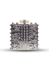 Salma Mother of Pearl Clutch by The Tan Clan featuring an elegant pearl-embellished design and sleek rectangular shape.