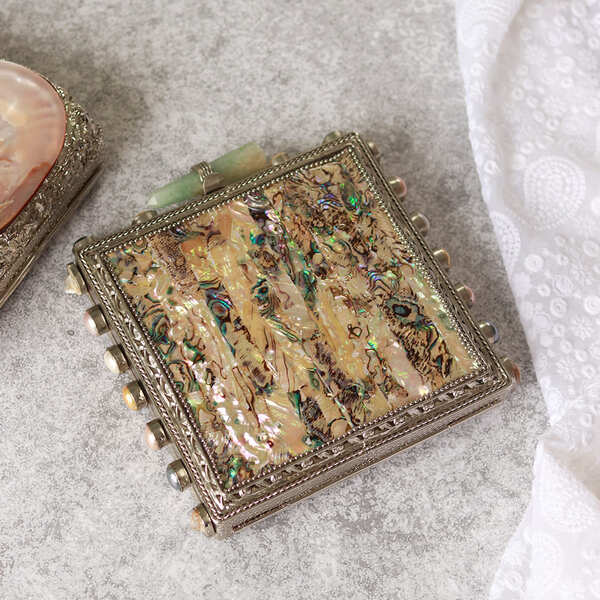 Salma Mother of Pearl Clutch by The Tan Clan, elegant evening bag with iridescent pearl finish and sleek design.