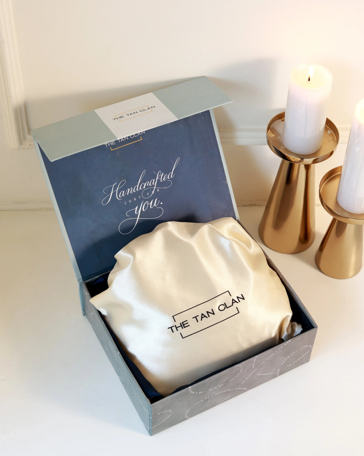 Elegant Sana Mother of Pearl Clutch by The Tan Clan, featuring intricate embellishments and a sleek, compact design.