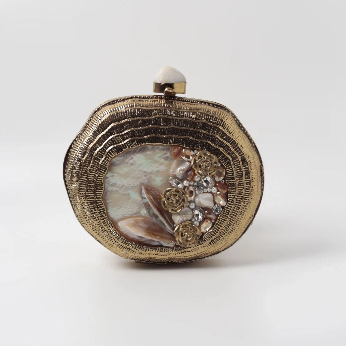 Sana embellished mother of pearl clutch by The Tan Clan, featuring intricate detailing and elegant design.