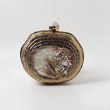 Sana embellished mother of pearl clutch by The Tan Clan, featuring intricate detailing and elegant design.
