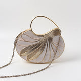 Elegant Saniya Embellished Mother of Pearl Clutch by The Tan Clan featuring intricate pearl and bead embellishments.