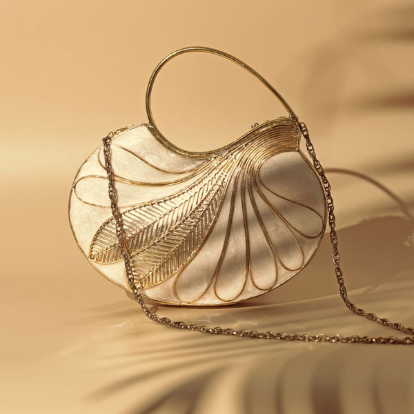 Elegant Saniya Embellished Mother of Pearl Clutch by The Tan Clan with intricate detailing and shimmering pearl accents.