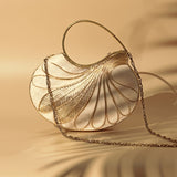 Elegant Saniya Embellished Mother of Pearl Clutch by The Tan Clan with intricate detailing and shimmering pearl accents.