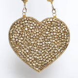 Scarlett Mini Heart Bag by The Tan Clan featuring a small pink heart-shaped design with a gold chain strap.