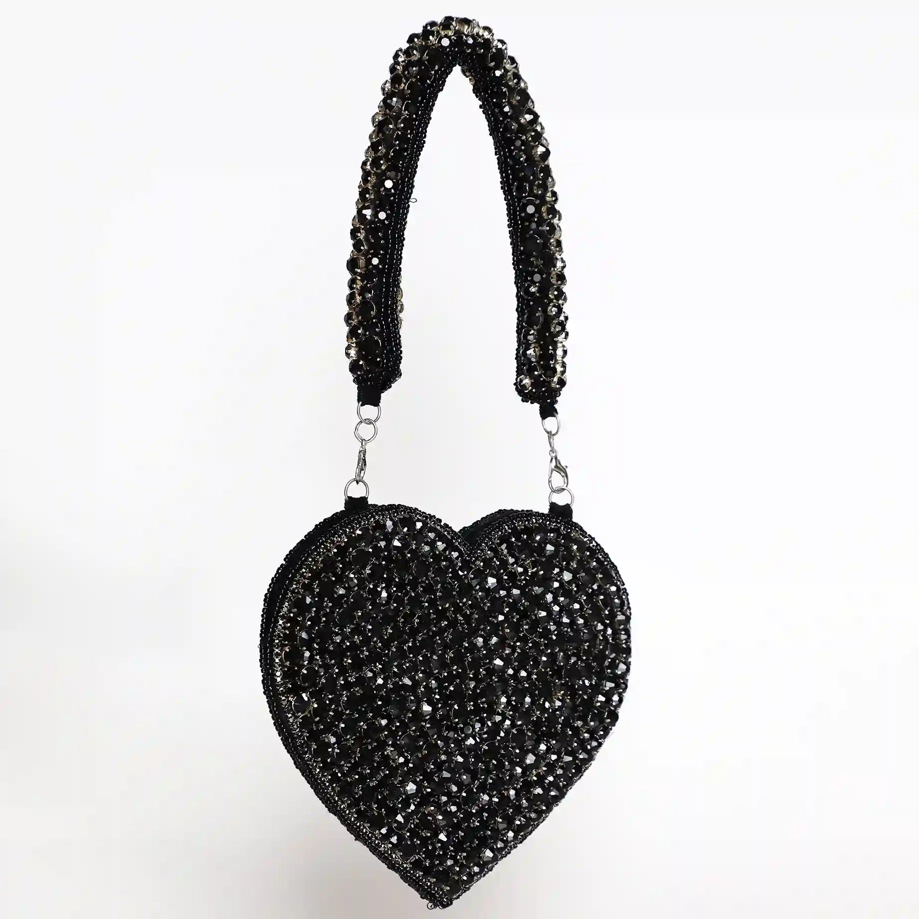 Black Scarlett Mini Heart Bag by The Tan Clan, showing a compact bag with a heart-shaped design and stylish strap.
