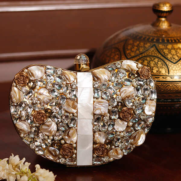 Golden Seher embellished brass clutch bag with intricate detailing, designed by The Tan Clan.