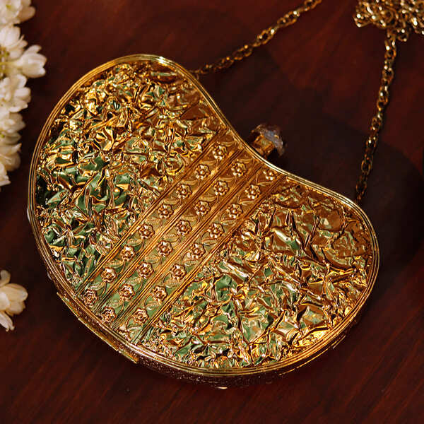 Golden Seher Embellished Brass Clutch with intricate design and embellishments by The Tan Clan.