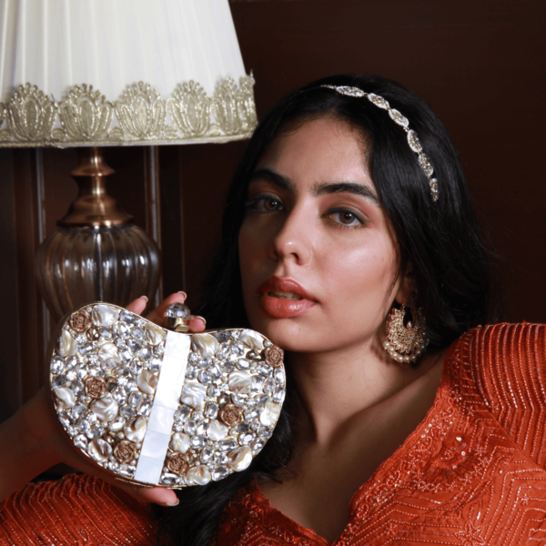 Golden Seher embellished brass clutch bag with intricate detailing and a sleek design by The Tan Clan.