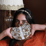 Golden Seher embellished brass clutch bag with intricate detailing and a sleek design, ideal for elegant occasions.