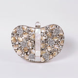 Silver brass clutch bag with intricate embellishments and elegant design, crafted by The Tan Clan.