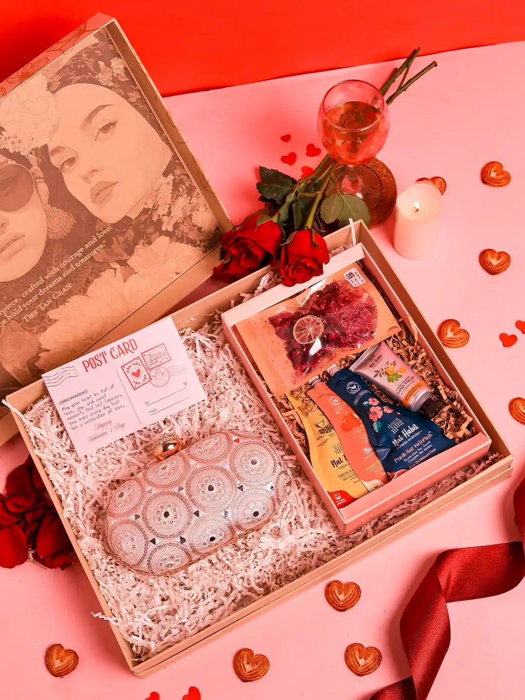 Self-care gift set featuring Inaara oval clutch and Nathabit items from THE TAN CLAN, displayed with six gift pieces.