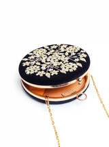 Black embroidered clutch bag with intricate hand embroidery by The Tan Clan, featuring a sleek, elegant design.
