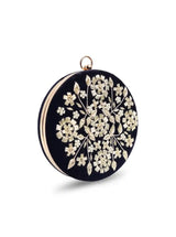 Black embroidered clutch bag by The Tan Clan featuring intricate hand embroidery and a sleek, elegant design.